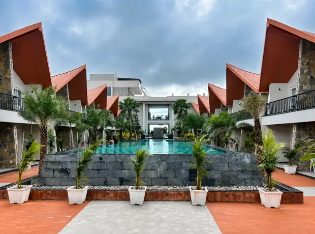 Central pool courtyard framed by the resort villas