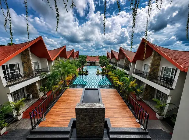 Private villas opening toward the pool